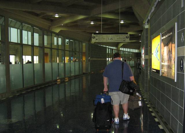 Gus walking down the terminal