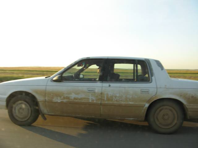 Dirty car on the road