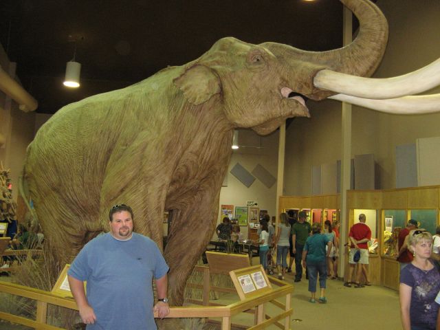 Gus standing next to a Columbian mammoth