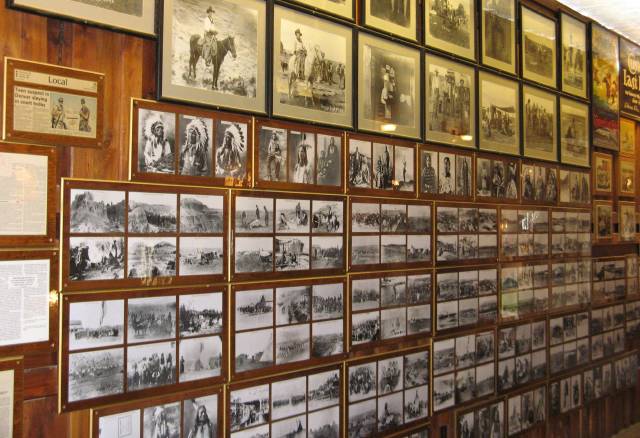 Old time photos on a wall at Wall Drug